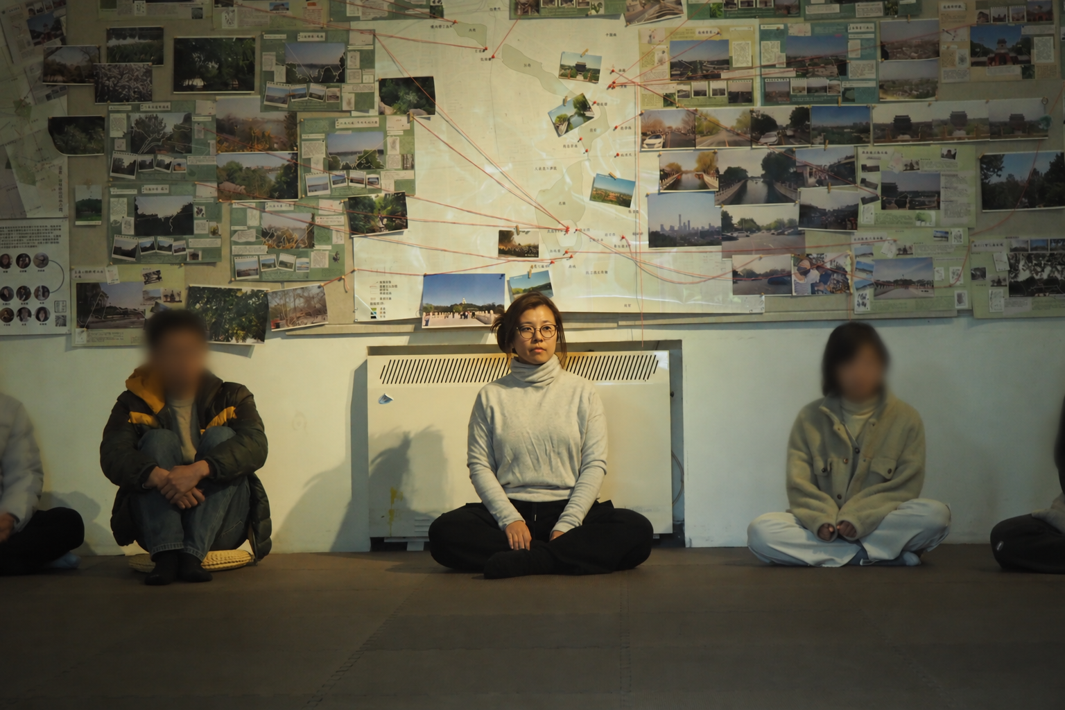 Chenxi Meng seated in an embodied practice setting